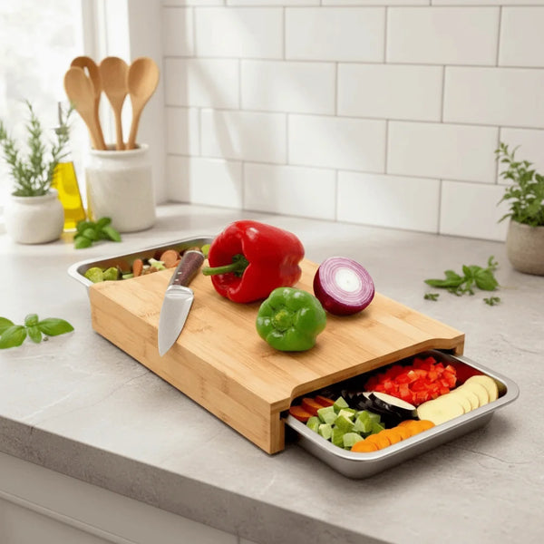 Beech wood cutting board with knife and vegetables on a kitchen counter