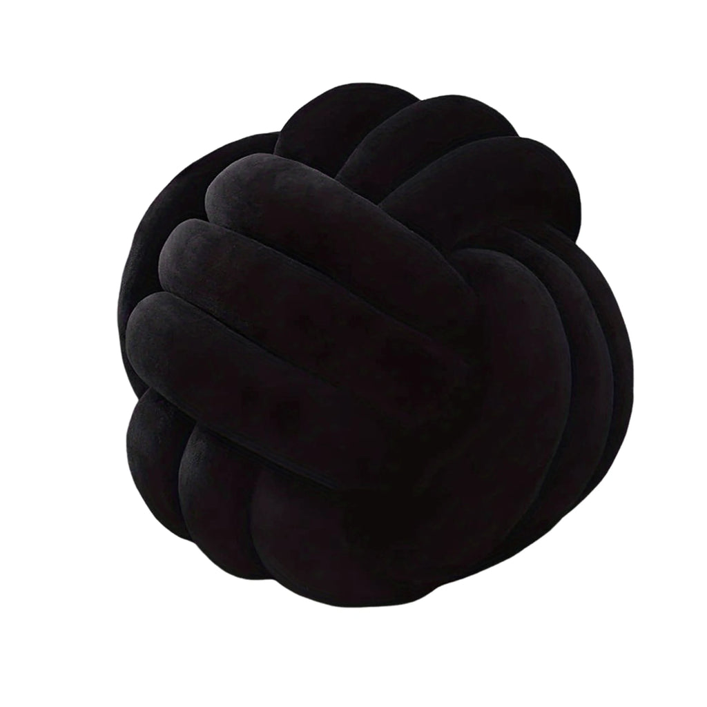 Black knot shaped pillow on a white background