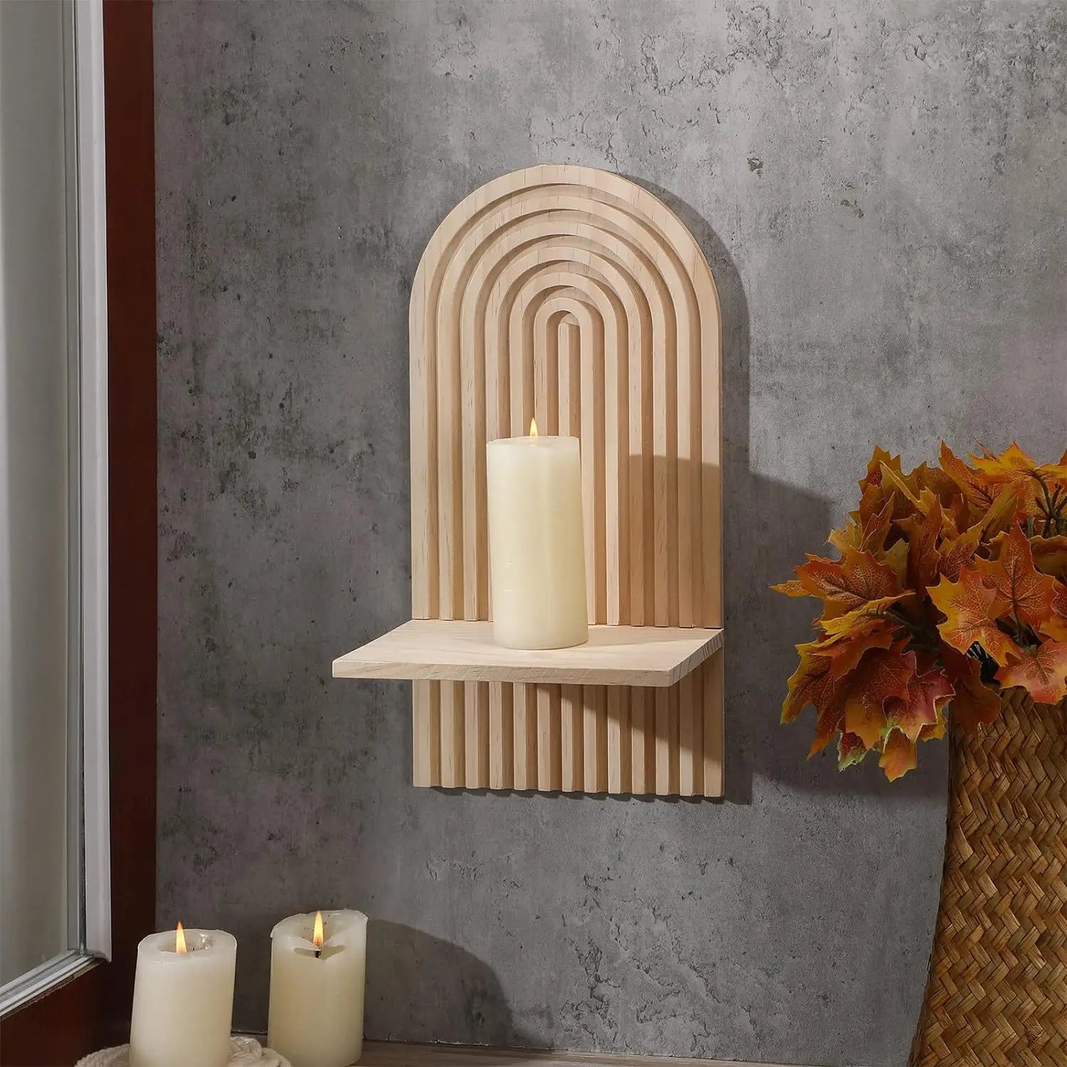 Boho Wooden Floating Wall Shelf with a candle against a gray concrete wall