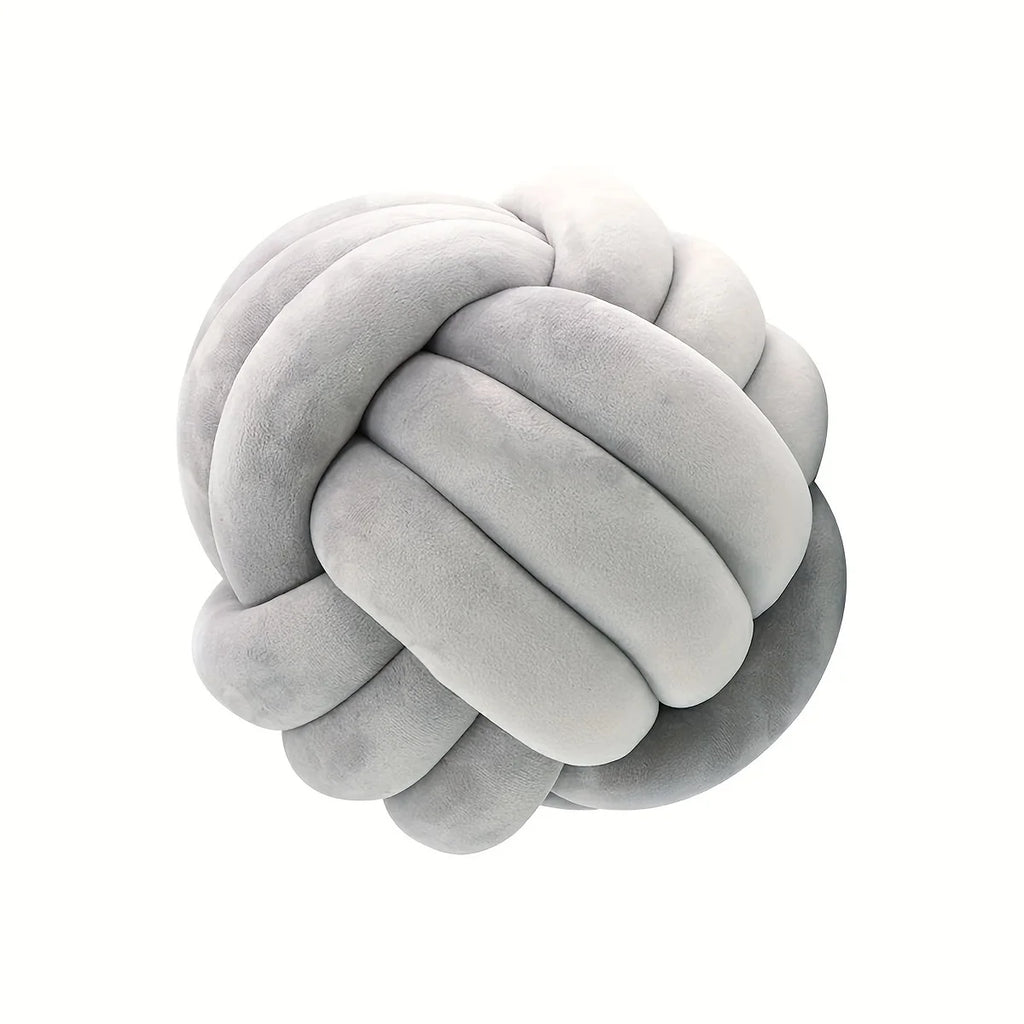 Gray knot shaped pillow on a white background