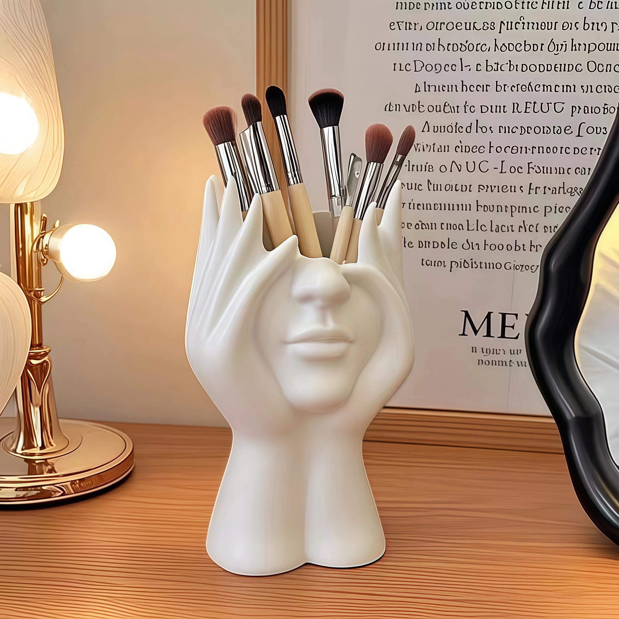 Nordic Human Body Sculpture Desk Organizer with makeup brushes on a wooden surface.