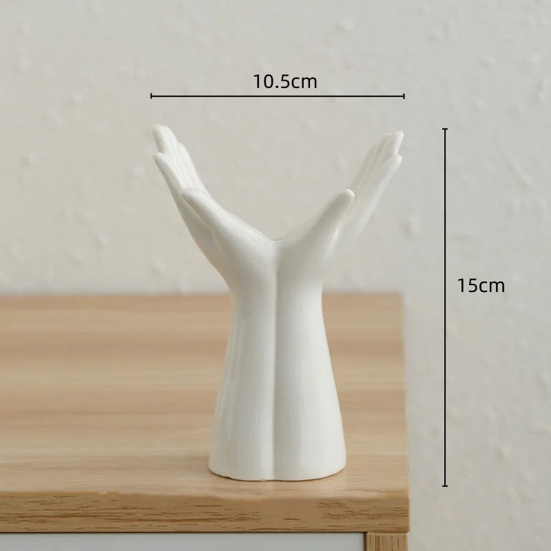 Small white Ceramic Hand Vase on a wooden surface with measurements indicated.