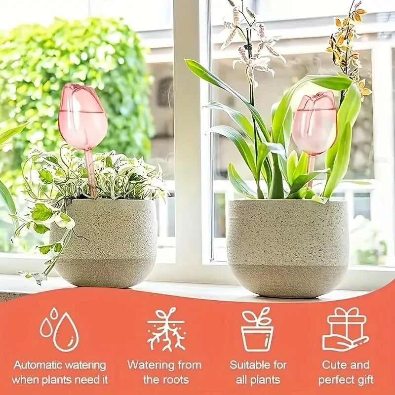 Two potted plants with pink tulip watering globes on a windowsill, featuring automatic watering system.